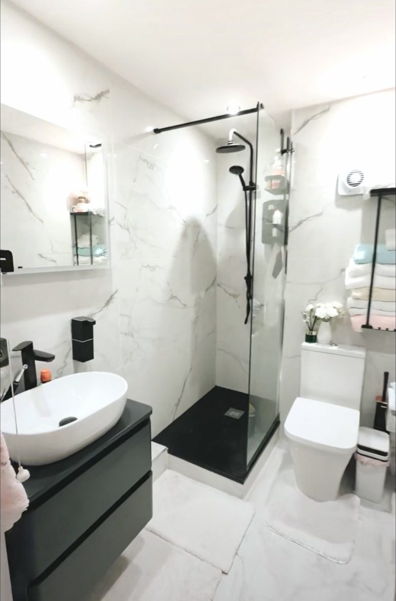 Finished marble bathroom with walk-in shower
