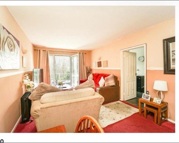Living room before — dated peach decor with red carpet, Weston-super-Mare